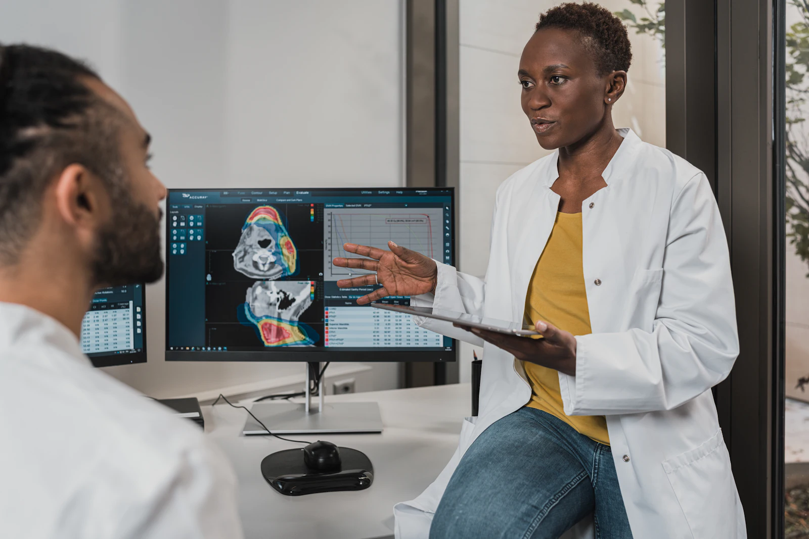 A specialist reviewing imaging results with a colleague