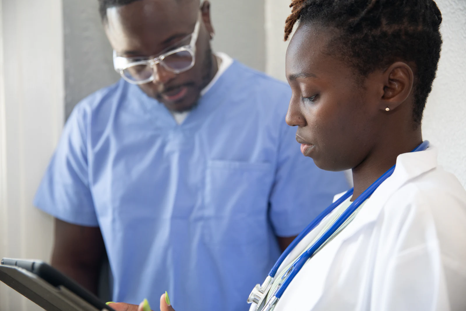 Two clinicians reviewing a case together